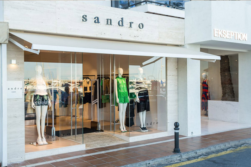 Sandro Boutique Project with Italy Ivory White Travertine Facade & Display Shelving