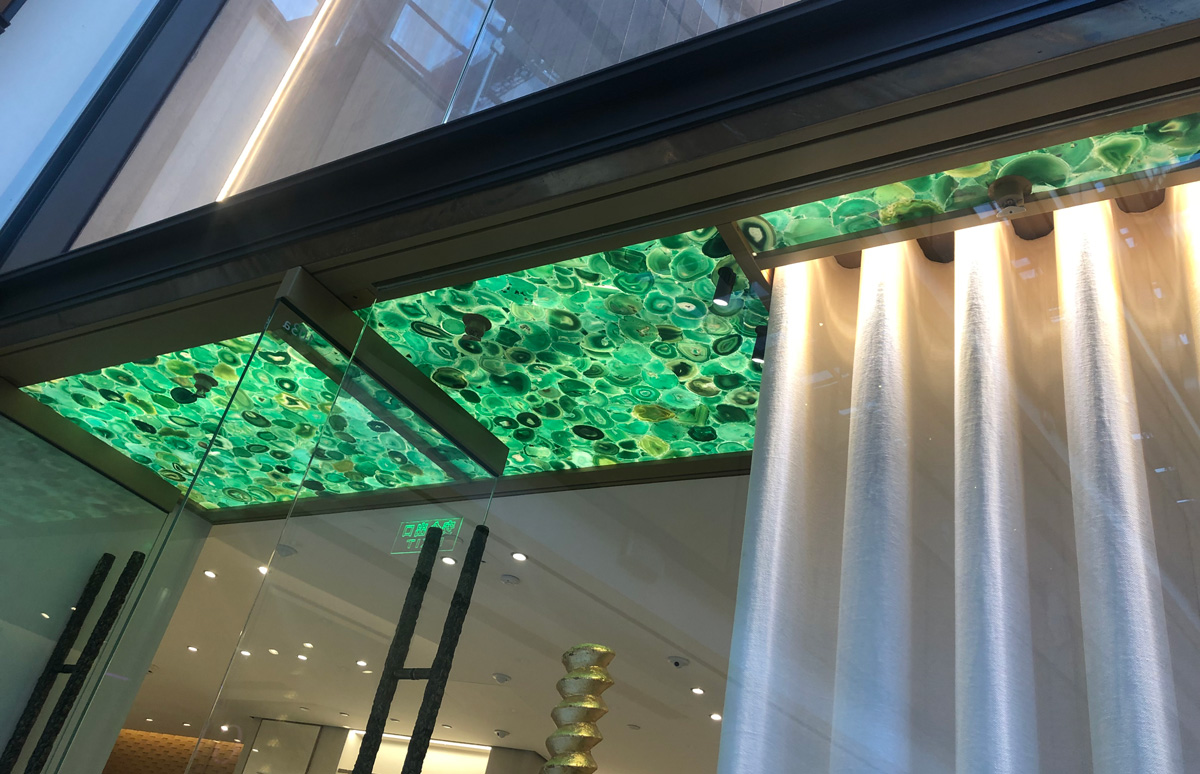 LOEWE Store Design with Backlit Green Agate Stone