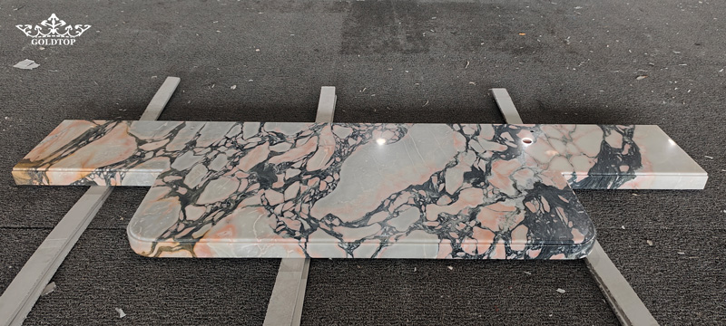 calacatta pink Marble Countertops with custom curved drop-down aprons