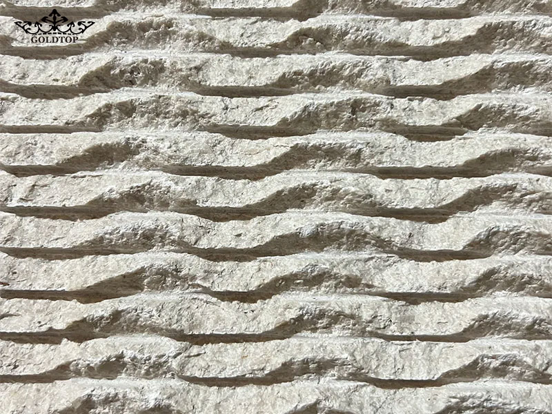 A wave finish features continuous, flowing relief across the stone surface.