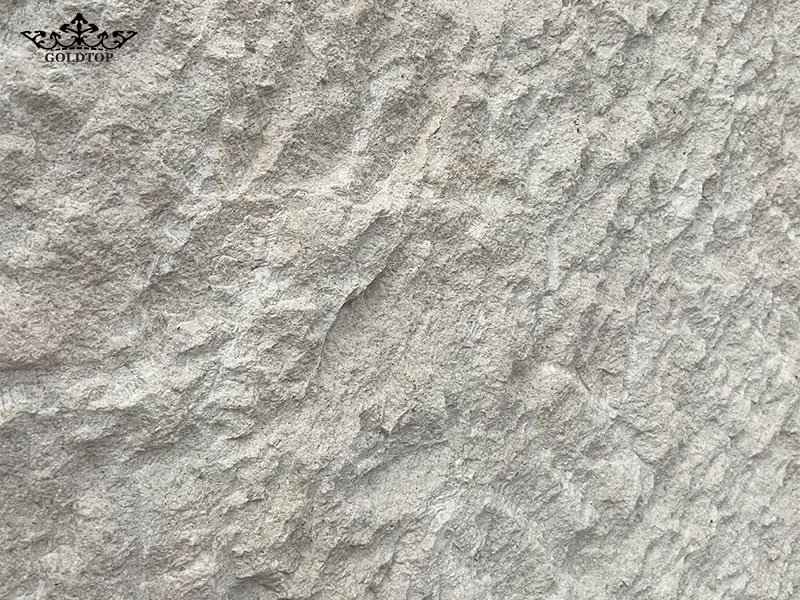 The natural finish preserves much of the stone's original character, creating a rough, authentic appearance.