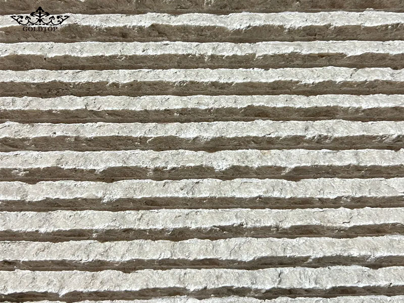 A grooved finish creates regular linear channels across the stone, giving the surface a clean and structured appearance.